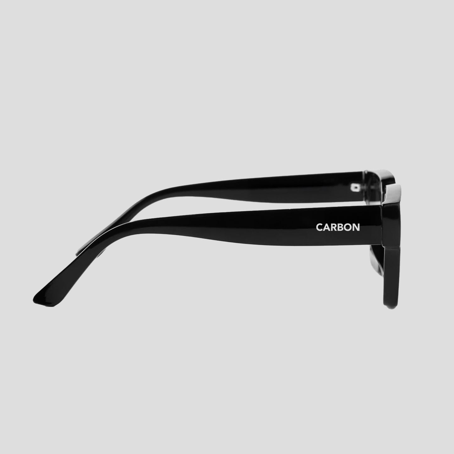 Angled view of Carbon NEXUS unisex black square sunglasses highlighting modern design
